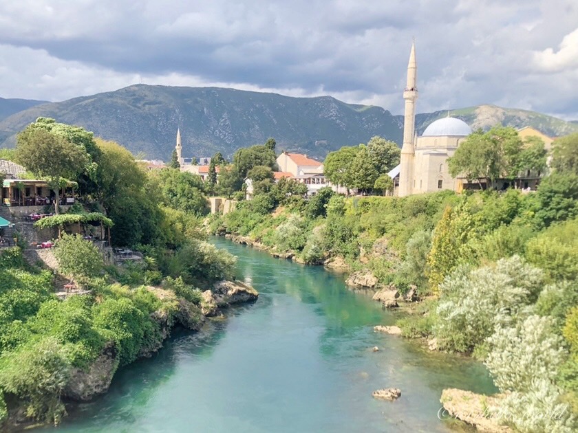 The Neretva River in Mostar with a mosque minaret in view